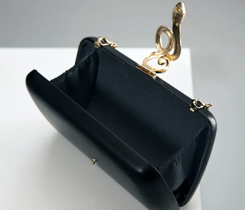 Golden snake black clutch