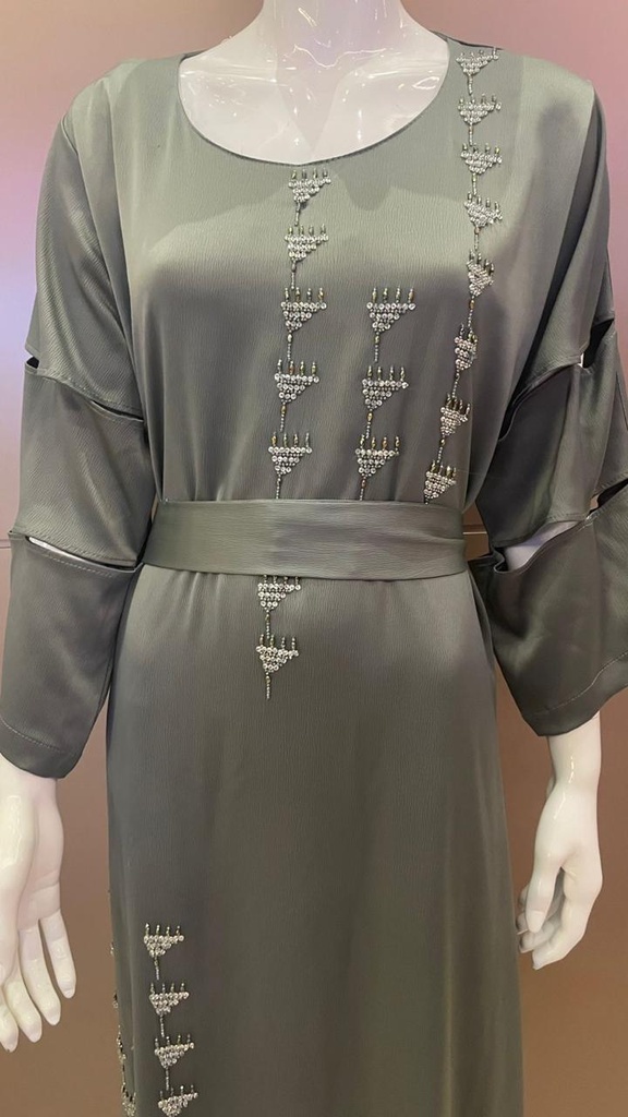 Green dress embellished with an intricate silver beaded design