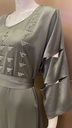 Green dress embellished with an intricate silver beaded design