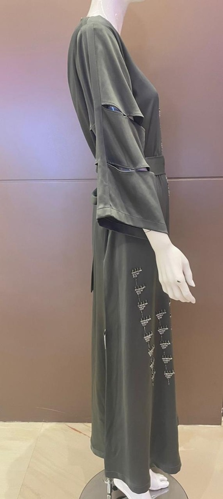 Green dress embellished with an intricate silver beaded design