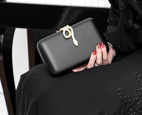 Golden snake black clutch