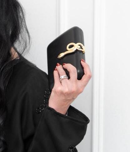 Golden snake black clutch