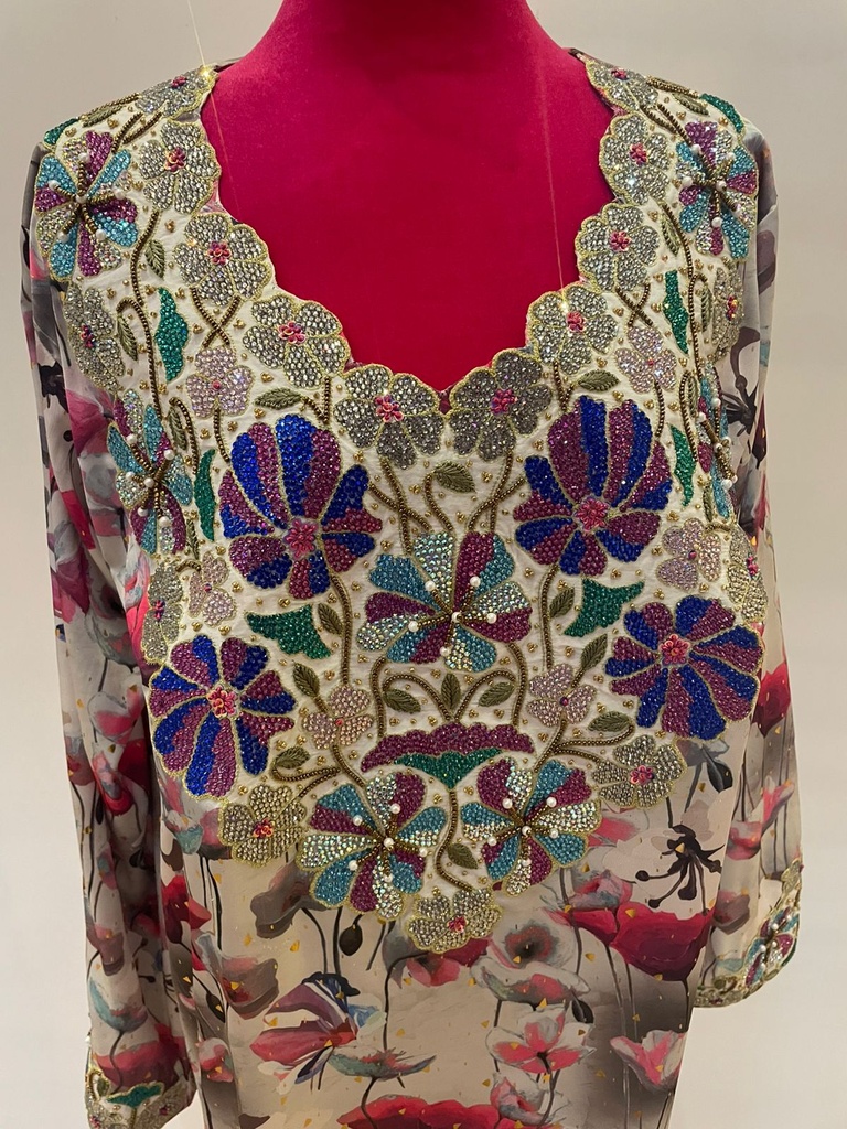  Beautifully embellished dress featuring an intricate floral print 