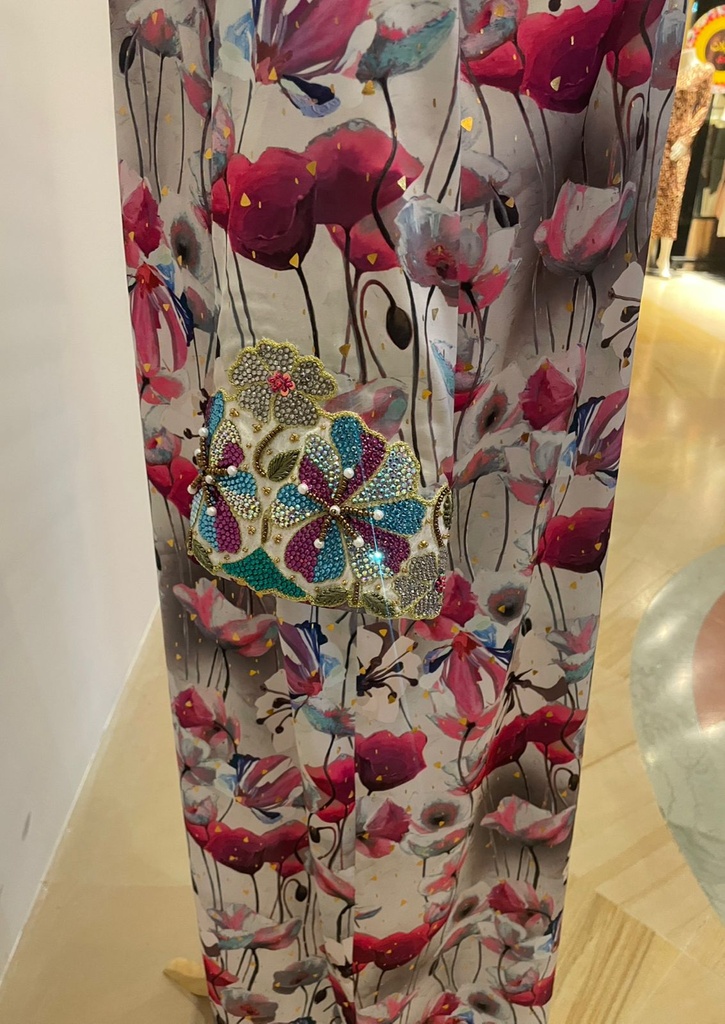  Beautifully embellished dress featuring an intricate floral print 